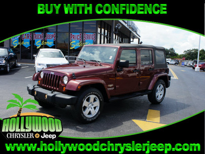 jeep wrangler unlimited 2007 red suv sahara gasoline 6 cylinders rear wheel drive automatic 33021