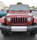 jeep wrangler unlimited 2010 red suv sahara gasoline 6 cylinders 4 wheel drive manual 45324