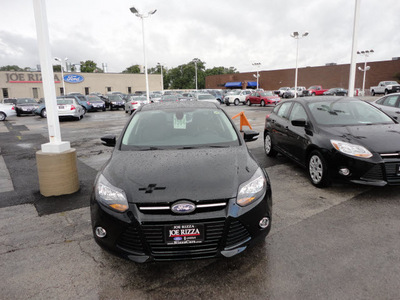 ford focus 2012 black sedan titanium gasoline 4 cylinders front wheel drive automatic with overdrive 60546