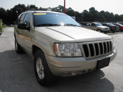 jeep grand cherokee 1999 gold suv gasoline 8 cylinders 4 wheel drive automatic 34731