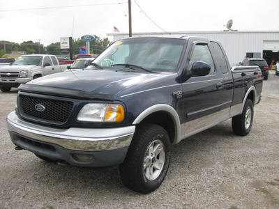 ford f 150 2003 blue lariat gasoline 8 cylinders sohc 4 wheel drive automatic with overdrive 62863