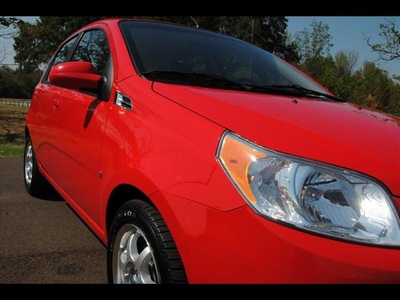 chevrolet aveo 2009 red hatchback aveo5 lt gasoline 4 cylinders front wheel drive automatic 75570