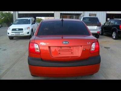 kia rio 2009 orange sedan lx gasoline 4 cylinders front wheel drive automatic 78238