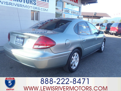 ford taurus 2006 lt  green sedan sel gasoline 6 cylinders front wheel drive automatic 98674