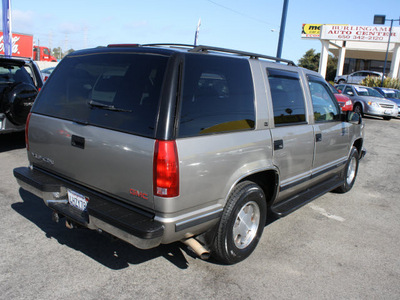 gmc yukon 1999 pewter suv sle gasoline v8 rear wheel drive automatic 94010