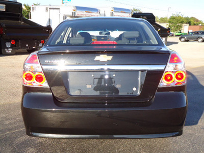 chevrolet aveo 2011 black sedan lt gasoline 4 cylinders front wheel drive automatic 60007