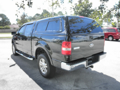 ford f 150 2005 black pickup truck lariat 8 cylinders 4 wheel drive automatic 32783