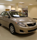 toyota corolla 2010 tan sedan le gasoline 4 cylinders front wheel drive automatic 27707