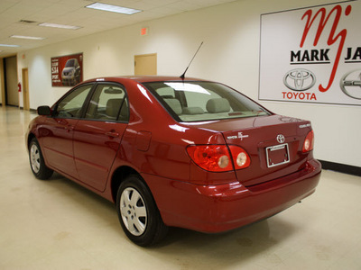 toyota corolla 2007 red sedan le gasoline 4 cylinders front wheel drive 5 speed manual 27707