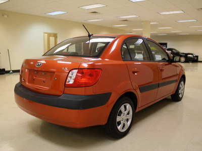 kia rio 2009 orange sedan lx gasoline 4 cylinders front wheel drive automatic 27707