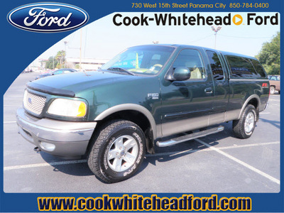 ford f 150 2002 dk  green lariat gasoline 8 cylinders 4 wheel drive automatic with overdrive 32401