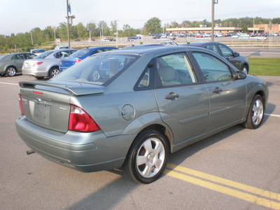ford focus 2006 green sedan zx4 gasoline 4 cylinders front wheel drive automatic with overdrive 13502