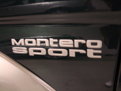 mitsubishi montero sport 1999 green suv limited gasoline 6 cylinders 4 wheel drive automatic 55305