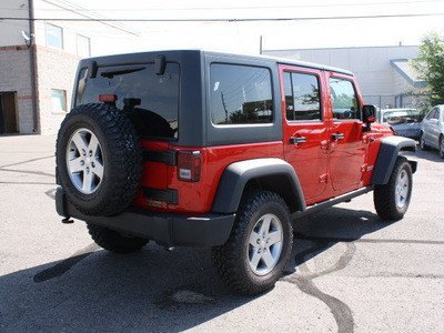 jeep wrangler unlimited 2011 red suv rubicon gasoline 6 cylinders 4 wheel drive automatic 80229