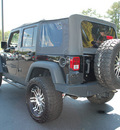 jeep wrangler unlimited 2010 black suv sport gasoline 6 cylinders 4 wheel drive 6 speed manual 27330