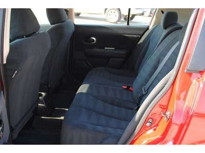 nissan versa 2010 red hatchback 1 8 s gasoline 4 cylinders front wheel drive 6 speed manual 77065