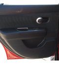 nissan versa 2010 red hatchback 1 8 s gasoline 4 cylinders front wheel drive 6 speed manual 77065