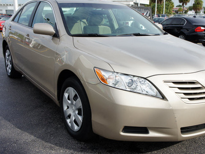 toyota camry 2009 tan sedan gasoline 4 cylinders front wheel drive 5 speed manual 33021