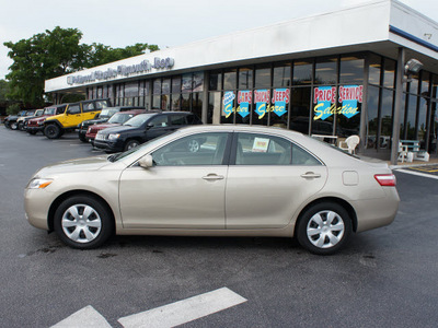 toyota camry 2009 tan sedan gasoline 4 cylinders front wheel drive 5 speed manual 33021