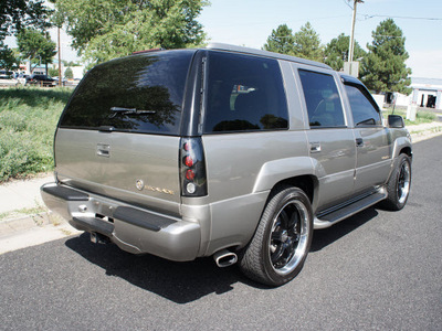 cadillac escalade 1999 silver suv custom wheels gasoline v8 4 wheel drive automatic with overdrive 80012