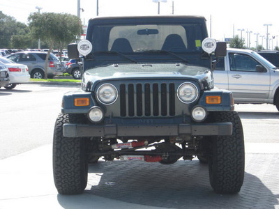 jeep wrangler 2002 green suv sahara gasoline 6 cylinders 4 wheel drive 5 speed manual 33884