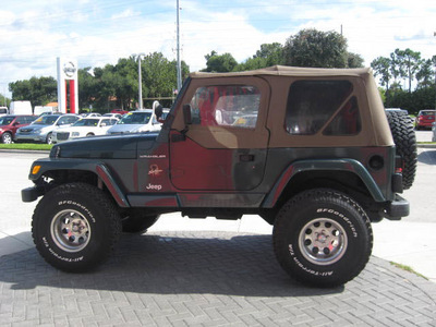 jeep wrangler 2002 green suv sahara gasoline 6 cylinders 4 wheel drive 5 speed manual 33884