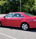toyota camry 2011 red sedan se gasoline 4 cylinders front wheel drive automatic 56001