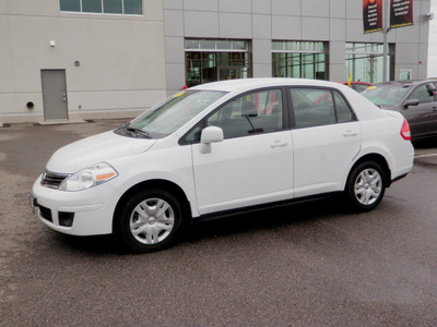 nissan versa 2010 white sedan 1 8 gasoline 4 cylinders front wheel drive automatic with overdrive 56001