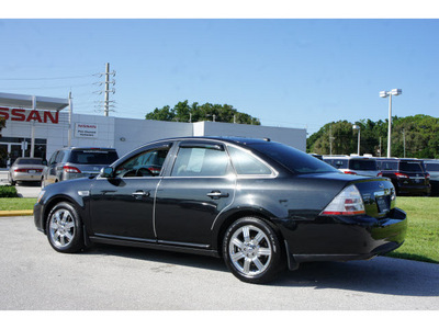 ford taurus 2009 black sedan limited gasoline 6 cylinders front wheel drive automatic 33870