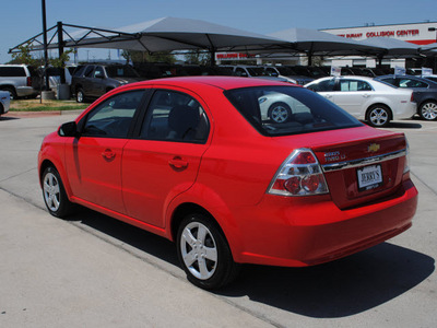 chevrolet aveo 2011 red sedan lt gasoline 4 cylinders front wheel drive automatic 76087