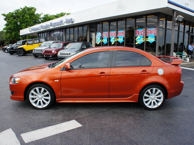 mitsubishi lancer 2009 orange sedan gts gasoline 4 cylinders front wheel drive automatic 33021