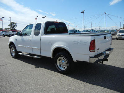 ford f 150 2000 off white pickup truck 4x4 xlt super cab gasoline 8 cylinders 4 wheel drive automatic with overdrive 55321