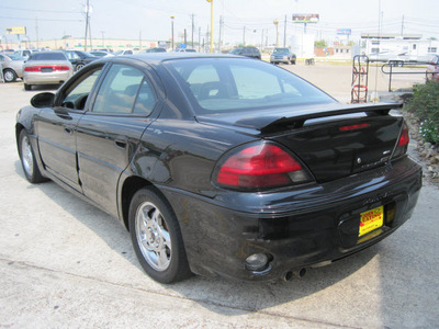 pontiac grand am 2004 black sedan gt gasoline 6 cylinders front wheel drive automatic 77037