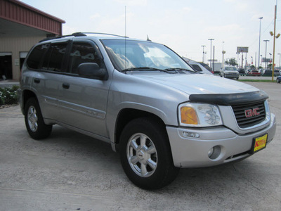 gmc envoy 2005 silver suv gasoline 6 cylinders rear wheel drive automatic 77037