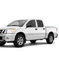 nissan titan 2011 white gasoline 8 cylinders 4 wheel drive not specified 98371