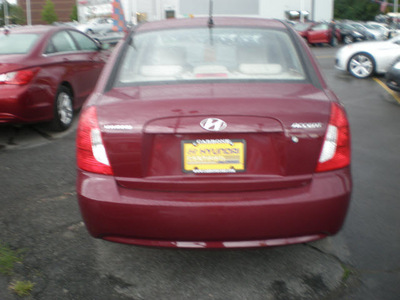 hyundai accent 2009 red sedan gls gasoline 4 cylinders front wheel drive automatic 13502