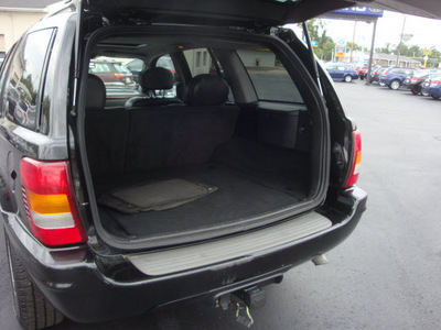 jeep grand cherokee 2004 black suv overland gasoline 8 cylinders 4 wheel drive automatic 45324