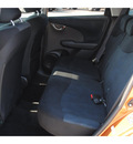 honda fit 2009 orange hatchback sport gasoline 4 cylinders front wheel drive automatic 77065