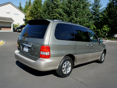 kia sedona 2003 green van ex gasoline 6 cylinders front wheel drive automatic with overdrive 98371