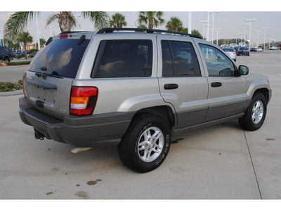 jeep grand cherokee 2004 silver suv laredo gasoline 8 cylinders rear wheel drive automatic with overdrive 77065