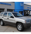 jeep grand cherokee 2004 silver suv laredo gasoline 8 cylinders rear wheel drive automatic with overdrive 77065