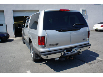 ford excursion 2002 silver suv xlt gasoline 10 cylinders 4 wheel drive automatic with overdrive 08902