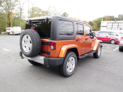 jeep wrangler unlimited 2011 orange suv sahara gasoline 6 cylinders 4 wheel drive automatic with overdrive 08844