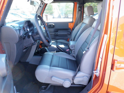 jeep wrangler 2010 orange suv unlmted rubicon gasoline 6 cylinders 4 wheel drive 6 speed manual 08844