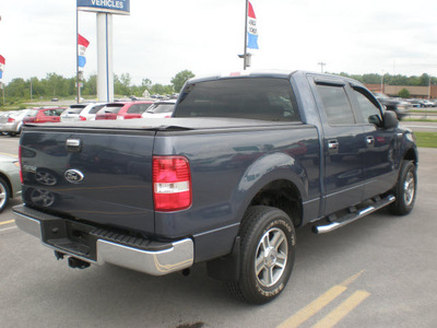 ford f 150 2006 blue gasoline 8 cylinders 4 wheel drive automatic with overdrive 13502