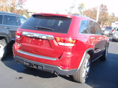 jeep grand cherokee 2011 red suv overland gasoline 8 cylinders 4 wheel drive automatic 07730