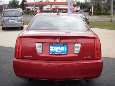 cadillac sts 2009 red sedan v6 gasoline 6 cylinders rear wheel drive automatic with overdrive 07702