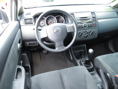 nissan versa 2009 silver sedan 1 6 gasoline 4 cylinders front wheel drive 5 speed manual 07060