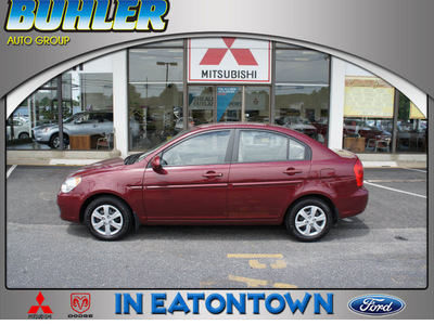 hyundai accent 2009 dk  red sedan gls gasoline 4 cylinders front wheel drive 5 speed manual 07724