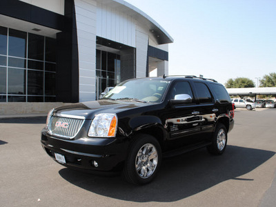 gmc yukon 2011 black suv slt flex fuel 8 cylinders 2 wheel drive automatic 76087